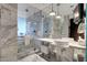 Modern bathroom with double vanity, large shower, and soaking tub at 4381 W Flamingo Rd # 3309, Las Vegas, NV 89103