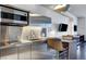 Contemporary kitchen with stainless steel appliances and breakfast bar at 4381 W Flamingo Rd # 3309, Las Vegas, NV 89103