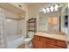 Well-lit bathroom featuring a shower-tub combo and granite vanity at 4400 S Jones Blvd # 1138, Las Vegas, NV 89103