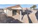 Covered patio and a small backyard with a block wall for privacy at 4634 Skybolt St, Las Vegas, NV 89115