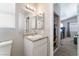 Bathroom with a vanity, toilet and access to bedroom closet at 4634 Skybolt St, Las Vegas, NV 89115