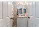 Clean bathroom with a vanity, toilet and shower/tub combo at 4634 Skybolt St, Las Vegas, NV 89115