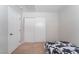 Bright bedroom featuring a bed and large sliding closet doors at 4634 Skybolt St, Las Vegas, NV 89115