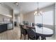 Dining room with a large table, six chairs, and a chandelier at 4634 Skybolt St, Las Vegas, NV 89115