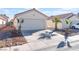 House exterior showcasing a two-car garage and desert landscaping at 4634 Skybolt St, Las Vegas, NV 89115