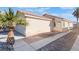 House exterior with walkway, garage, and desert landscaping at 4634 Skybolt St, Las Vegas, NV 89115