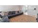 Living room features a sectional sofa and view into dining area at 4634 Skybolt St, Las Vegas, NV 89115