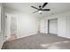 Bedroom with ceiling fan, carpet flooring and en-suite bathroom at 4801 Alameda Ave, Las Vegas, NV 89110