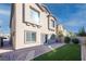 Landscaped backyard with artificial turf and paved patio at 487 Via Renata, Henderson, NV 89044