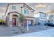 Two-story house with attached garage and landscaped front yard at 487 Via Renata, Henderson, NV 89044