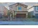 Two-story house with attached garage and front yard at 487 Via Renata, Henderson, NV 89044