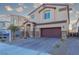 Two-story house with attached garage and brick driveway at 487 Via Renata, Henderson, NV 89044