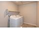 Laundry room with washer, dryer, and shelving at 487 Via Renata, Henderson, NV 89044