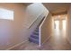 Modern staircase with gray carpeting and tile flooring at 487 Via Renata, Henderson, NV 89044