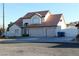 Two-story house with three-car garage and terracotta roof at 6701 Willow River Ct, Las Vegas, NV 89108