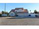 Two-story house with three-car garage and terracotta roof at 6701 Willow River Ct, Las Vegas, NV 89108