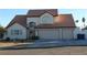 Two-story house with three-car garage and terracotta roof at 6701 Willow River Ct, Las Vegas, NV 89108