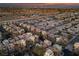 Aerial view of a community with numerous houses, showcasing the neighborhood's layout and surrounding area at 9331 Hilgard Ave, Las Vegas, NV 89178