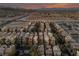 Expansive aerial view of desert planned community with palm trees dotting the landscape and distant mountains at 9331 Hilgard Ave, Las Vegas, NV 89178