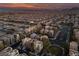 Sunset aerial view of a desert neighborhood with neatly planned streets and lush landscaping throughout at 9331 Hilgard Ave, Las Vegas, NV 89178