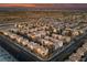 An aerial view captures a well-planned community with uniform architecture and a scenic backdrop at 9331 Hilgard Ave, Las Vegas, NV 89178