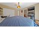 Spacious bedroom with ensuite bathroom, closet, and entertainment center at 9331 Hilgard Ave, Las Vegas, NV 89178