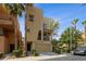 Modern two-story home with a small balcony, front yard landscaping, and attached garage at 9331 Hilgard Ave, Las Vegas, NV 89178