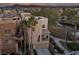 Exterior aerial view of two story home with front yard, balcony, and two car garage at 9331 Hilgard Ave, Las Vegas, NV 89178