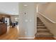 Inviting foyer with hardwood floors, a staircase, and an adjacent dining area at 9331 Hilgard Ave, Las Vegas, NV 89178