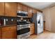 Modern kitchen with stainless steel appliances, including a gas range, microwave, and refrigerator at 9331 Hilgard Ave, Las Vegas, NV 89178