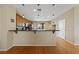 Bright, airy kitchen with breakfast bar, wooden floors, and seamless access to the outdoor area at 9331 Hilgard Ave, Las Vegas, NV 89178