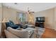Comfortable living room with modern furnishings, including a plush sectional and a wall-mounted TV at 9331 Hilgard Ave, Las Vegas, NV 89178