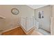 A naturally lit stairway features stylish hardwood flooring and white railing at 9331 Hilgard Ave, Las Vegas, NV 89178