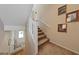 A carpeted staircase offers a comfortable transition between floors, enhancing the home's appeal at 9331 Hilgard Ave, Las Vegas, NV 89178