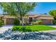 Beautiful house with two-car garage and manicured lawn at 10077 Clifton Forge Ave, Las Vegas, NV 89148