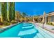 Sparkling pool with large patio and lush landscaping at 10077 Clifton Forge Ave, Las Vegas, NV 89148