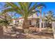 Outdoor patio area with mature plants and a built-in grill at 1046 Weatherboard St, Henderson, NV 89011