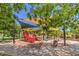 Modern playground with shade structures for  at 10466 Smokewood Rd, Las Vegas, NV 89135