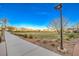 Wide paved pathway with green space and park views at 10466 Smokewood Rd, Las Vegas, NV 89135