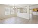 Bright dining room with tile floors and view to kitchen at 1132 Highbury Grove St, Henderson, NV 89002