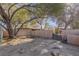 Backyard view of garage, wall, and pergola at 1200 Cashman Dr, Las Vegas, NV 89102