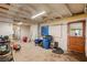 Unfinished basement area with storage and a door at 1200 Cashman Dr, Las Vegas, NV 89102