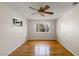 Hardwood floor bedroom with ceiling fan and window at 1200 Cashman Dr, Las Vegas, NV 89102