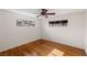 Well-lit bedroom featuring hardwood floors and a ceiling fan at 1200 Cashman Dr, Las Vegas, NV 89102