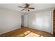 Spacious bedroom with hardwood floors, ceiling fan, and double closets at 1200 Cashman Dr, Las Vegas, NV 89102