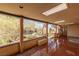 Spacious covered patio with red flooring, skylights, and views of the backyard at 1200 Cashman Dr, Las Vegas, NV 89102