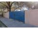 Blue metal gate entrance to the property at 1200 Cashman Dr, Las Vegas, NV 89102