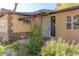 Inviting front entrance with security door and stone accents at 1200 Cashman Dr, Las Vegas, NV 89102