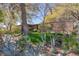 Ranch style home with mature trees and xeriscaped landscaping at 1200 Cashman Dr, Las Vegas, NV 89102
