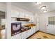 Kitchen with white cabinets, wood countertops and vintage stove at 1200 Cashman Dr, Las Vegas, NV 89102